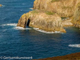 Rock in a sapphire sea