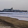 Pier in lively sea