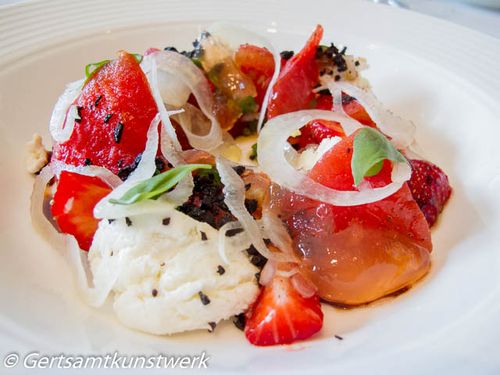 Tomato and strawberry salad with goat’s curd, basil and olives