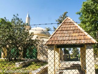 Mosque behind barbed wire