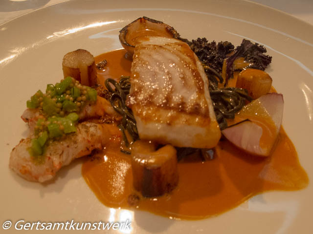 Isle of gigha halibut with langoustines, turnip tops, roasted salsify and shellfish sauce GH