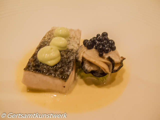 Steamed cornish bass, poached oyster, pickled cucumber, squid ink, champagne sauce